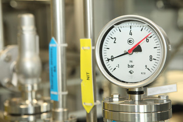 Gates, taps, monometers at the pharmaceutical plant. Open the supply of medicine to the reactor....