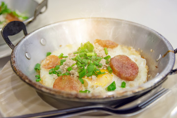 Fried egg with pork and smoke on mini pan