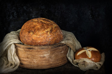 Bread on rustic wooden background