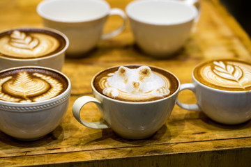 art latte on a cappuccino coffe cup