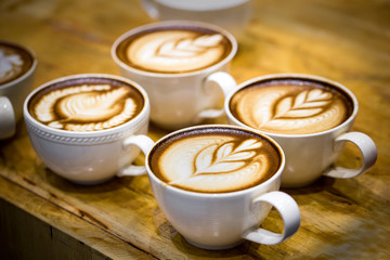art latte on a cappuccino coffe cup