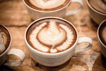 art latte on a cappuccino coffe cup