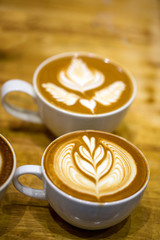 art latte on a cappuccino coffe cup