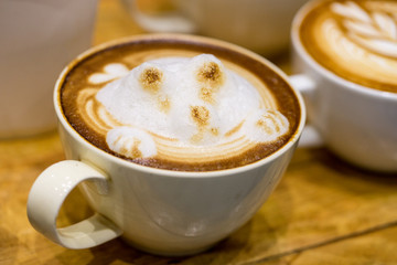 art latte on a cappuccino coffe cup