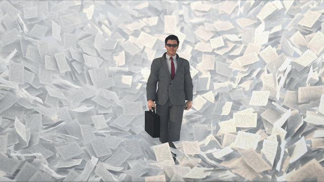 businessman in a paper storm