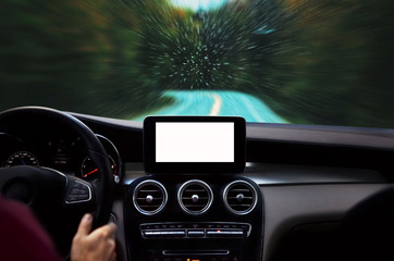 Man driving car on rainy day through the forest. Raindrops splashed on windshield. Mockup of modern navigation device