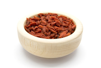 Dried Goji berries in wooden bowl
