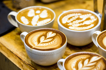 art latte on a cappuccino coffe cup