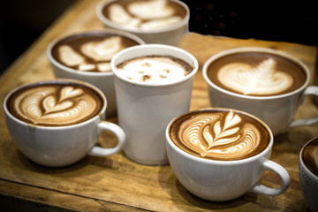 art latte on a cappuccino coffe cup