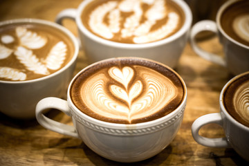 art latte on a cappuccino coffe cup