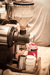 Coffee Grinder with coffee beans in close-up view