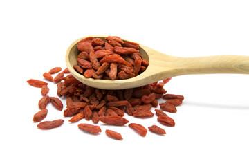 Dried Goji berries in wooden spoon