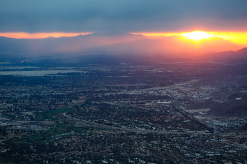 Early morning sunlight coming through the cloud cover over the desert city of Palm Springs