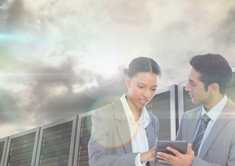 Businesspeople using digital tablet