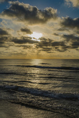 Sunrise on the beach and clouds