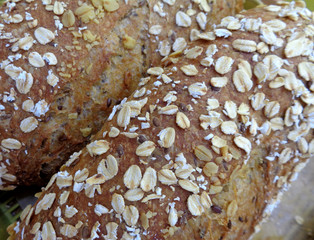 Closed up whole grain bread loaves for background, banner, texture 