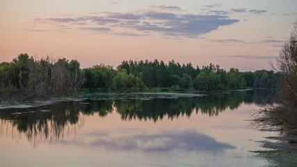 Fototapeta na wymiar Rural scenery in the evening by the river