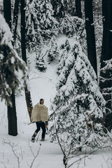 viking hunter walking in snow winter forest with steel axe and sword, viking warrior hunting in...