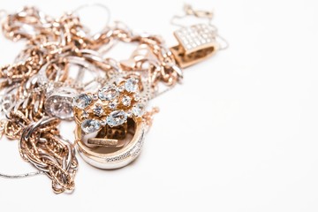 Beautiful golden jewelry. Many fashionable women's jewelry. Macro shot.