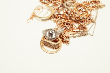 Beautiful golden jewelry. Many fashionable women's jewelry. Macro shot.