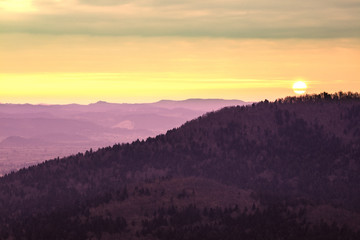 Sun rise over the mountain forest in Slovenia..