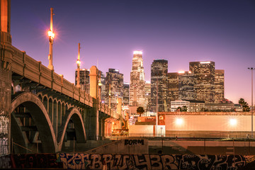 Fototapeta premium Skyscrapers in downtown Los Angeles California at night. View from under the bridge
