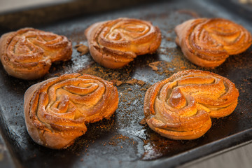 Ruddy buns lying on a baking sheet