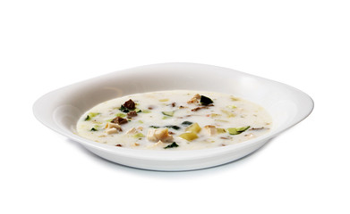 Creamy loaded baked potato soup on white backround