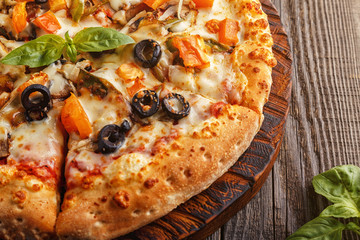 Vegetarian pizza with mozzarella cheese, tomatoes, champignons.