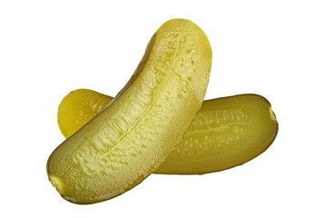 One pickled cucumber cut in half on white background