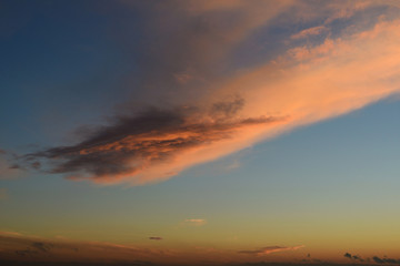 Big pink cloud on blue sky.