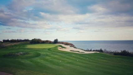 Fototapeta na wymiar Beautiful golf course on the top of the sea cliff