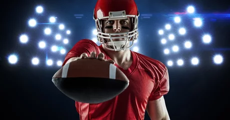 Foto op Canvas American football player showing ball against spotlight © vectorfusionart