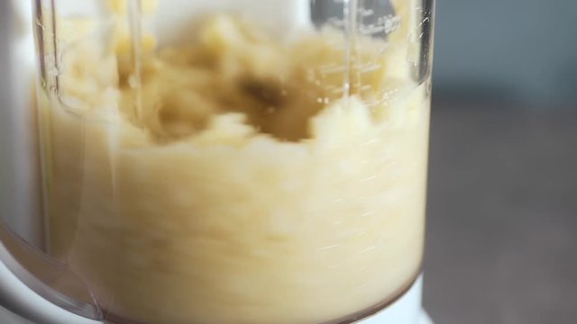 Bananas are crushed in a mixer, fruit puree, healthu food by yourself at home, diet and raw products