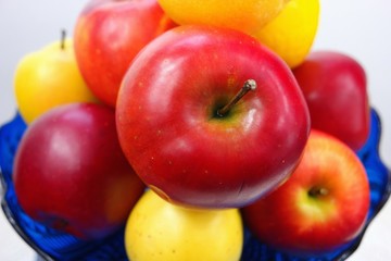 yellow and red apples on a blue background