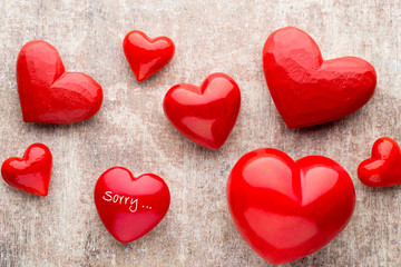Red heart on the wooden background.