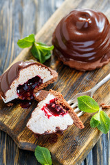 Chocolate souffle cake with berry confit and mint.