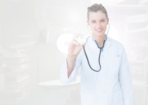 Female doctor using stethoscope on interface screen