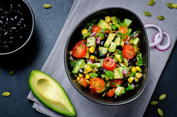 Black beans corn avocado red onion tomato salad with lime dressing