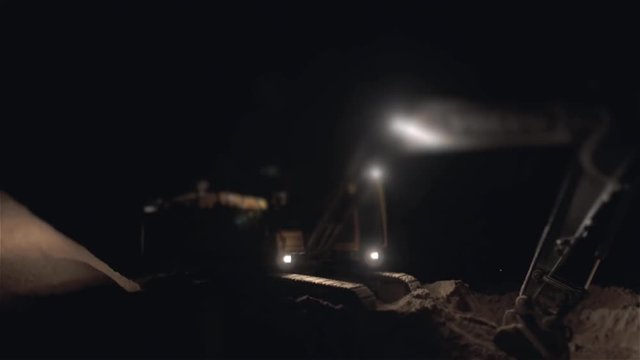 Excavator Digging Sand And Dust Working During Road Works At Night, Close Up Shot of Bucket of a Earth Mover Digging Machine, Night Working, Overtime