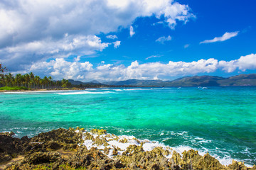 Caribbean sea surface summer wave background. Exotic water landscape with clouds on horizon. Natural tropical water paradise. Dominican Republic nature relax. Travel tropical island resort. Ocean natu
