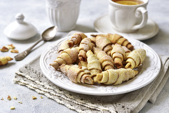 Cinnamon cookies and cup of tea for a breakfast.