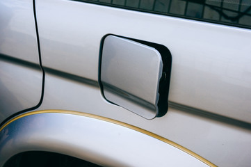 Oil filler cap opening at the gas station