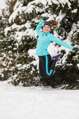 Winter sport, girl jumping in snow