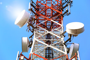 Telecommunication tower with antennas with blue sky