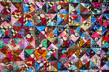 Fototapeta premium Quilt with distinct color abstract patterns, handmade domestic production