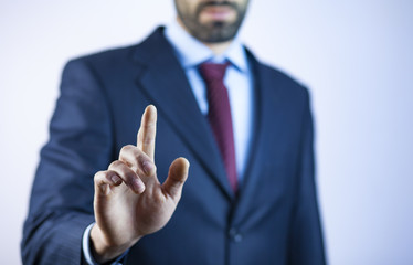Business man touching an imaginary screen