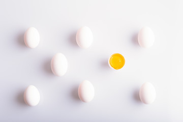 White eggs in a rows on white background