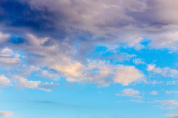 Background blue sky with stormy clouds