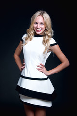 Blonde woman wearing white dress